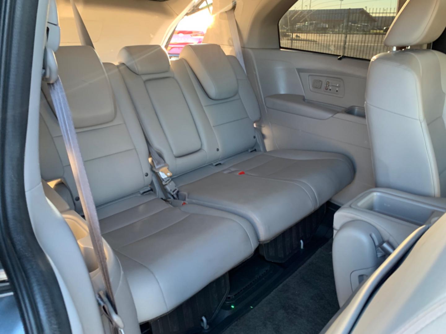 2012 Blue /gray Honda Odyssey Touring (5FNRL5H94CB) with an 3.7L L5 DOHC 20V engine, AUTOMATIC transmission, located at 1830 North Belt Line Road, Irving, TX, 75061, (469) 524-0199, 32.834373, -96.993584 - Photo#11